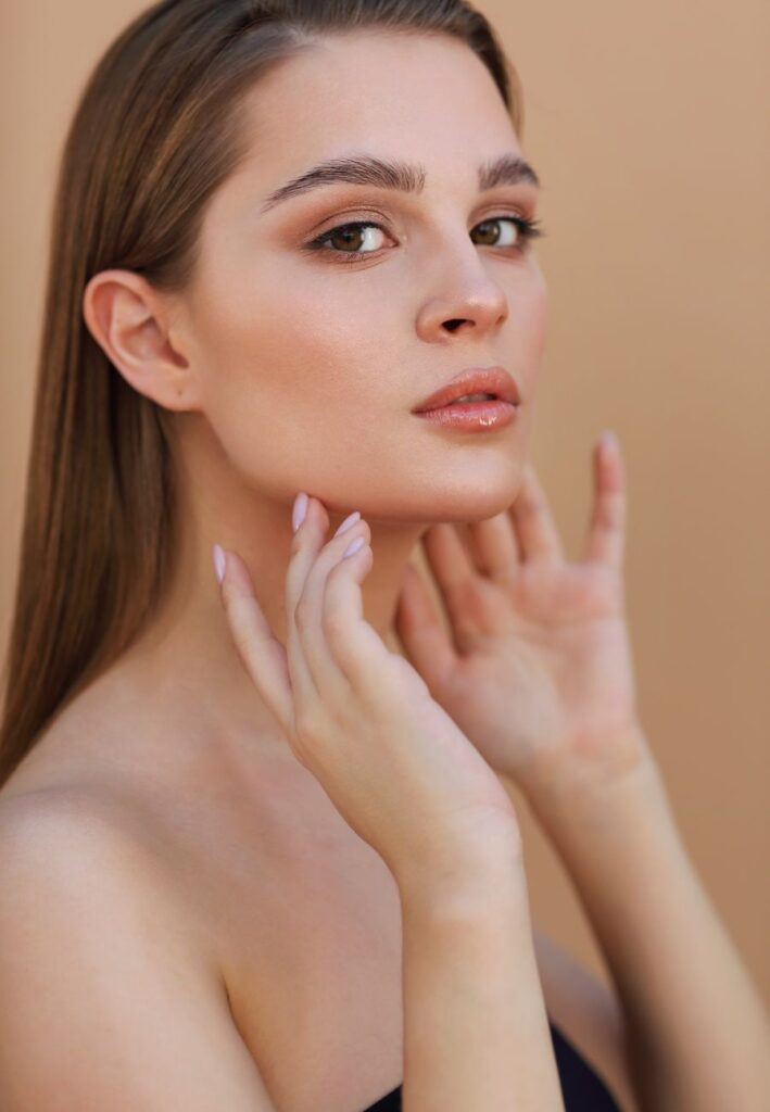 Close up of a woman with a smooth and radiant complexion after dermaplane treatment